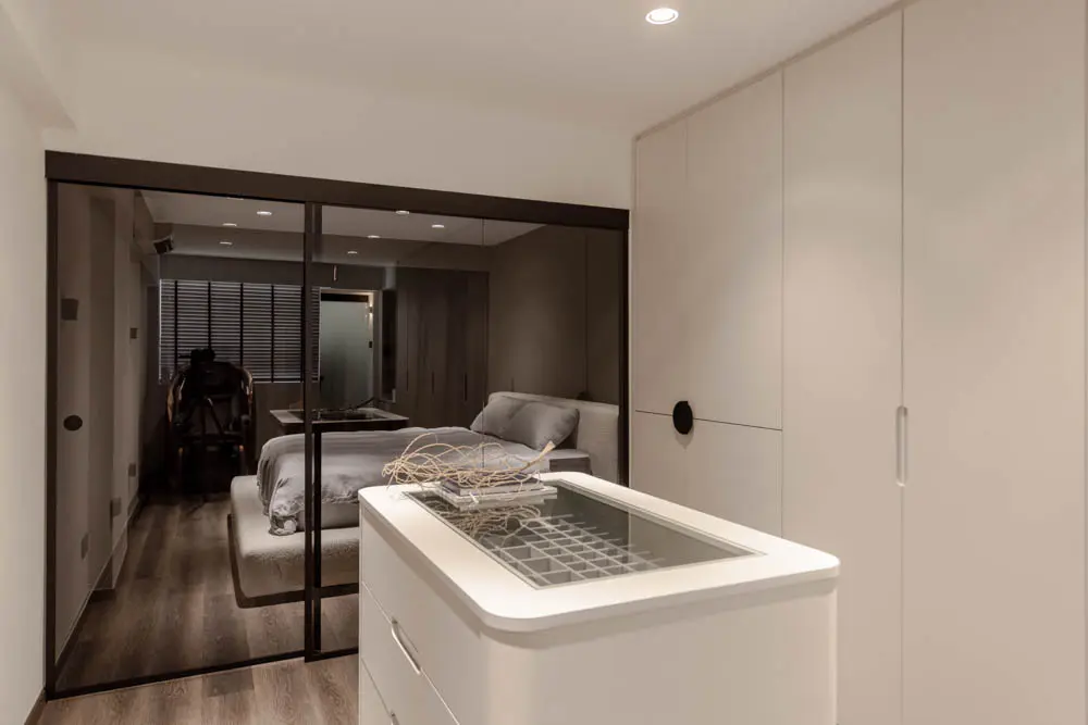 Walk-in wardrobe with its own accessories island